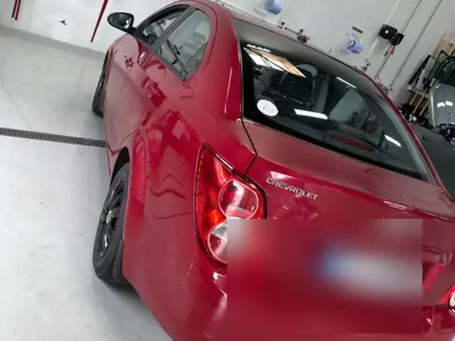 Rød Chevrolet Aveo efter rudeskift i Odense